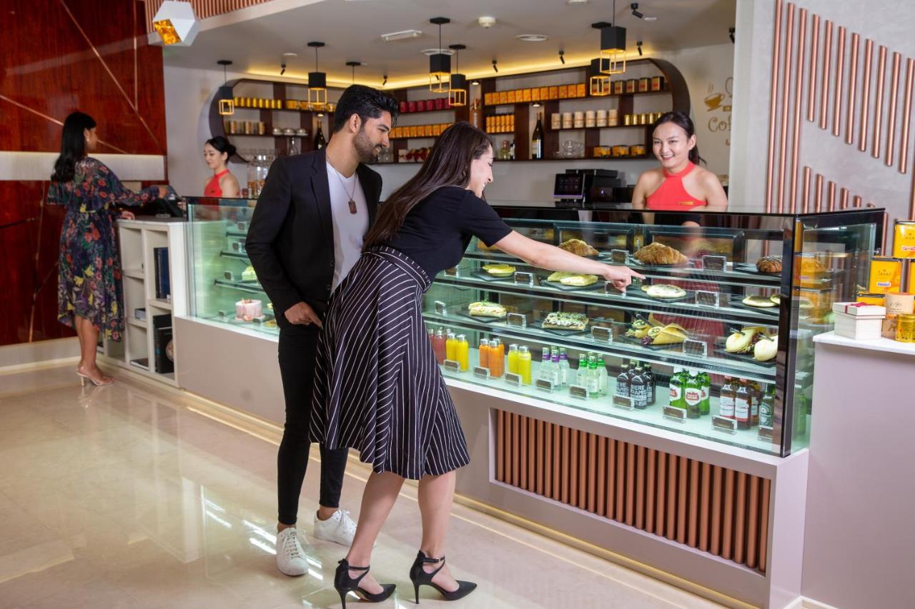 Park Regis Kris Kin Hotel Dubai Exterior foto A pastry shop in India